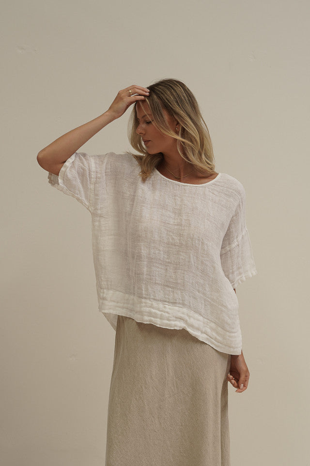 White combo Barbara linen top with a relaxed fit, breathable mesh panels and soft stonewashed texture.
