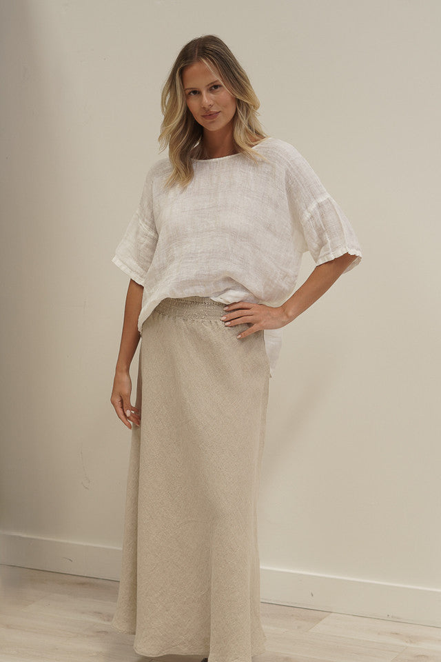 White combo Barbara linen top with a relaxed fit, breathable mesh panels and soft stonewashed texture.