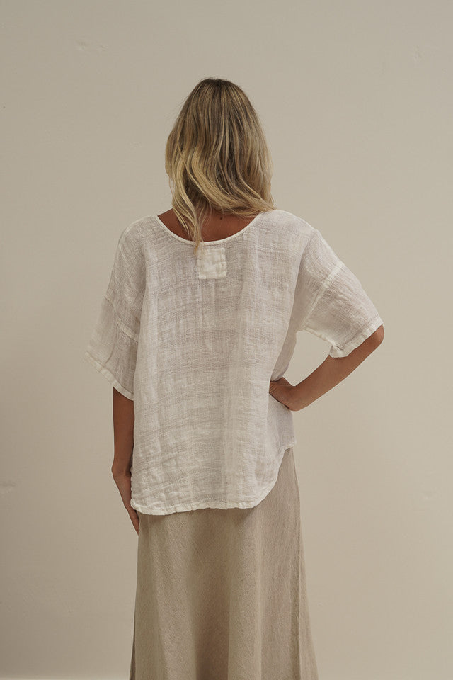 White combo Barbara linen top with a relaxed fit, breathable mesh panels and soft stonewashed texture.