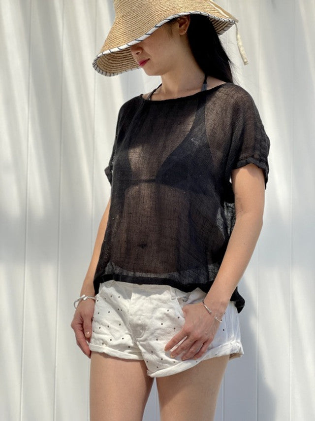 A black box-fit top made from 100% stonewashed mesh linen, featuring short sleeves and a crew neckline. The breathable, airy fabric and relaxed silhouette offer a soft, comfortable feel suitable for any season