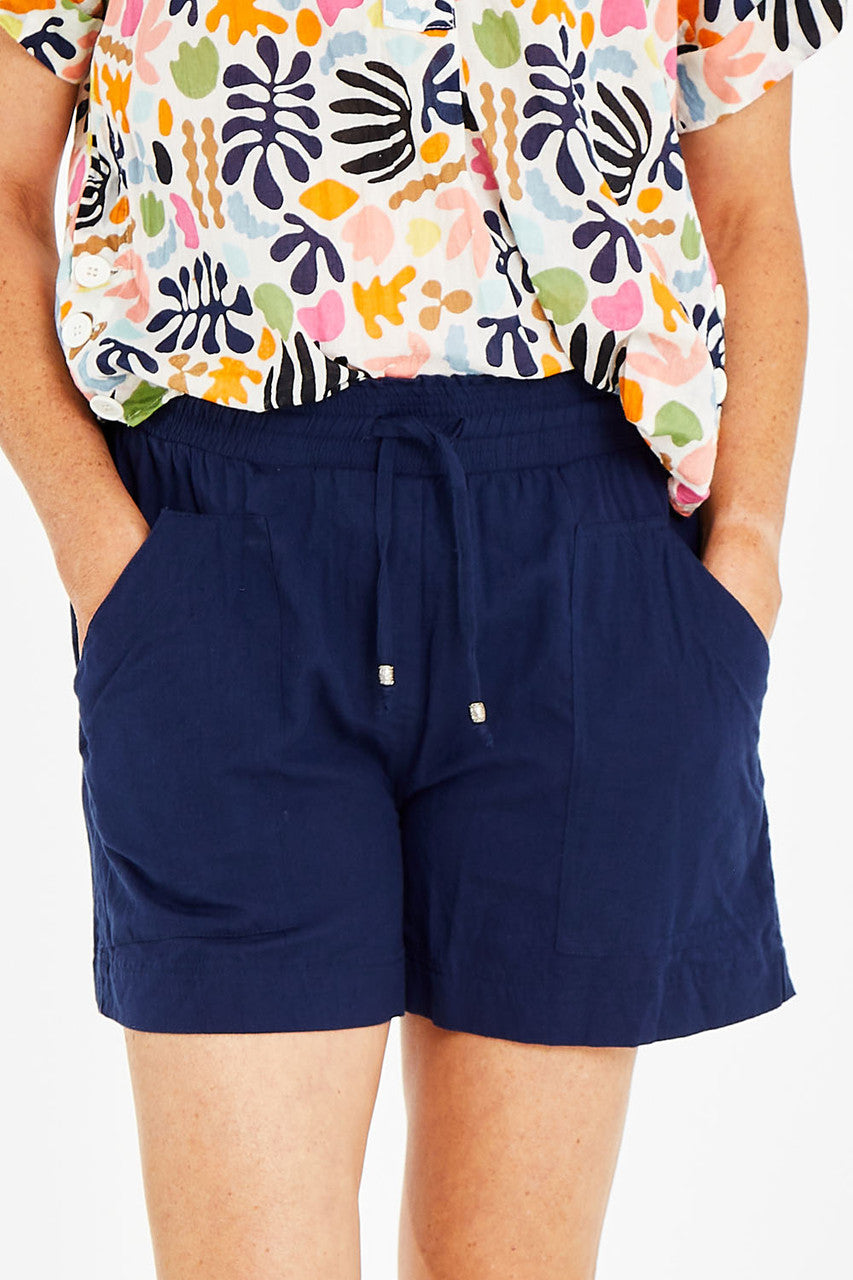 White lightweight cotton beach shorts for coastal summer wear