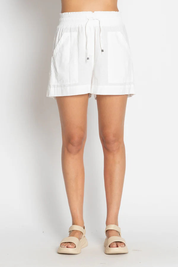 White cotton beach shorts with a relaxed fit and elastic waistband