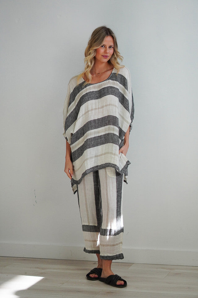 Bella Top in black stripey design, featuring a classic striped pattern, perfect for pairing with denim, linen trousers, or a structured skirt.
