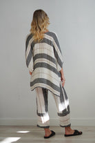 Bella Top in black stripey design, featuring a classic striped pattern, perfect for pairing with denim, linen trousers, or a structured skirt.