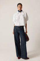 Beth Shirt in White crafted from 100% cotton, featuring short sleeves, a relaxed true-to-size fit, and a clean, versatile design for everyday wear.