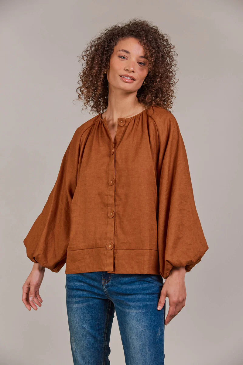 Hazel linen-cotton blend blouse with a collarless neckline, voluminous bishop sleeves, and a relaxed, hip-length silhouette for a stylish, contemporary look.