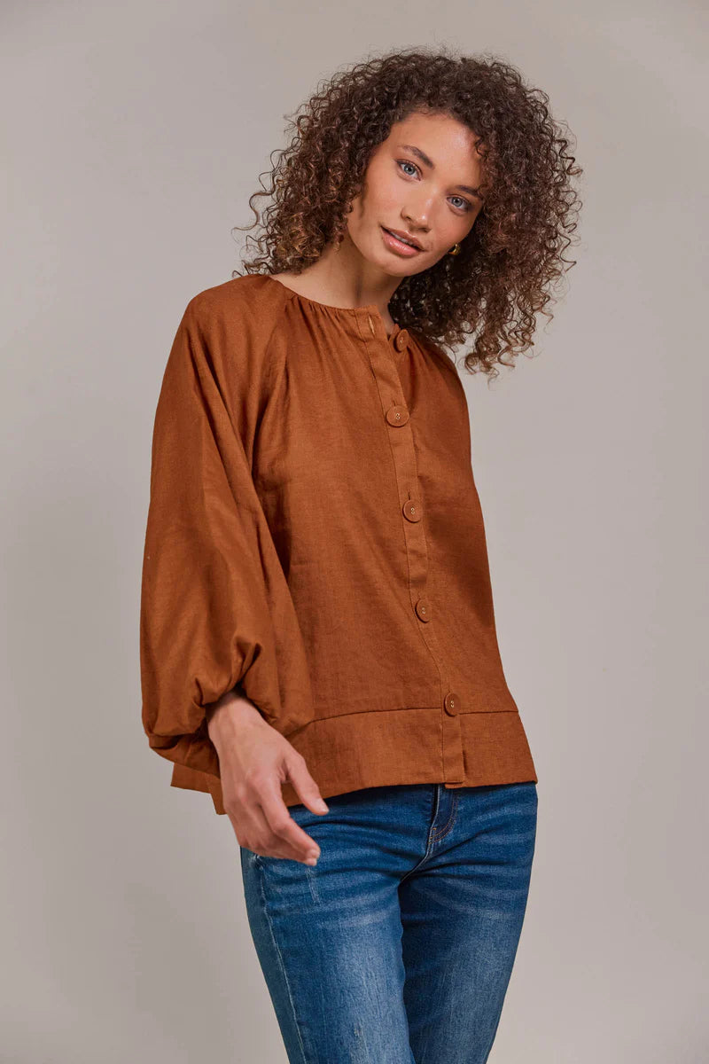 Hazel linen-cotton blend blouse with a collarless neckline, voluminous bishop sleeves, and a relaxed, hip-length silhouette for a stylish, contemporary look.