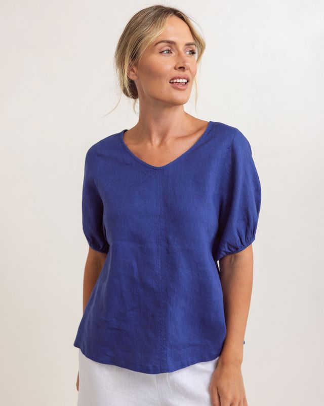 Lightweight denim-colored linen swing top with V-neck and relaxed fit, draping loosely over the body.