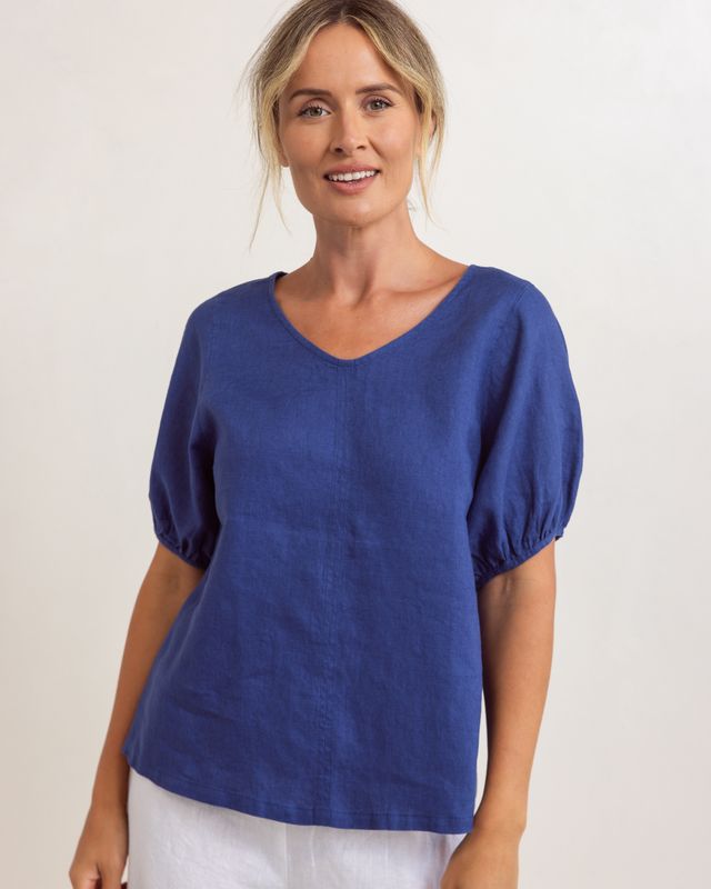 Lightweight denim-colored linen swing top with V-neck and relaxed fit, draping loosely over the body.