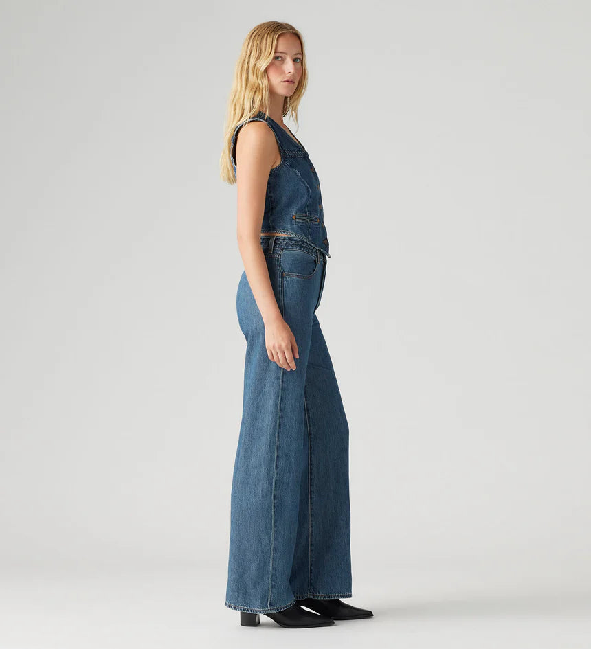 Women's Ribcage Wide Leg Braided Jeans, a high-rise, wide-leg denim with a braided waist detail, designed to define the waist and elongate the legs.