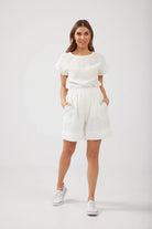 The White Broadway Shorts by Brave+True are currently available at Rawspice Boutique.