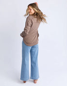 Foxwood Simplified Crew in chocolate brown with round neck, raw edge details, and side splits for a relaxed, everyday look.