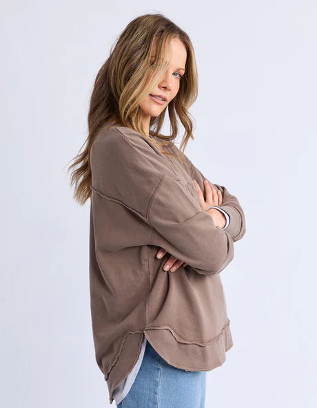 Foxwood Simplified Crew in chocolate brown with round neck, raw edge details, and side splits for a relaxed, everyday look.