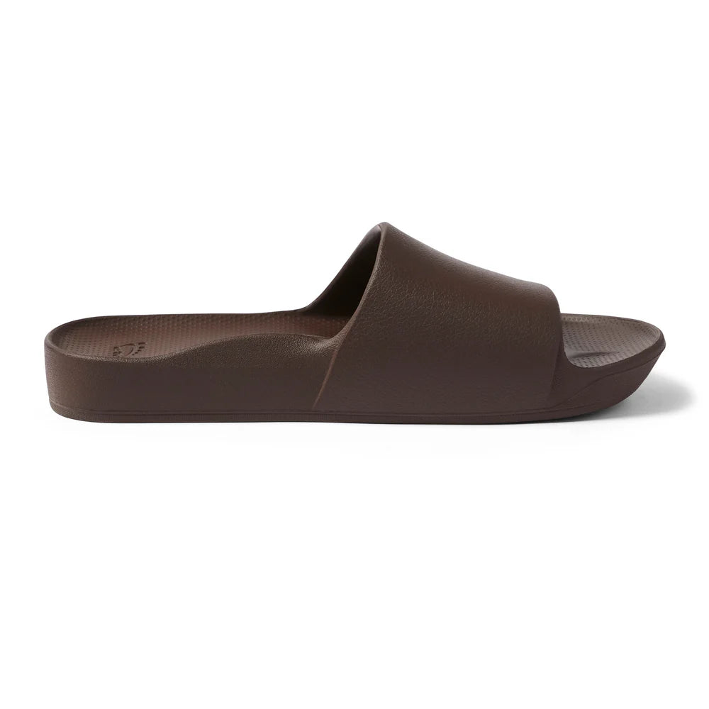 A pair of chocolate brown arch support slides with contoured footbeds and wide straps, designed for comfort and all-day wear.