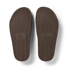 A pair of chocolate brown arch support slides with contoured footbeds and wide straps, designed for comfort and all-day wear.