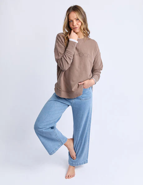 Foxwood Simplified Crew in chocolate brown with round neck, raw edge details, and side splits for a relaxed, everyday look.