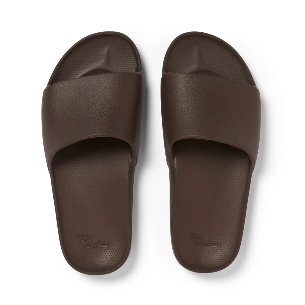 A pair of chocolate brown arch support slides with contoured footbeds and wide straps, designed for comfort and all-day wear.