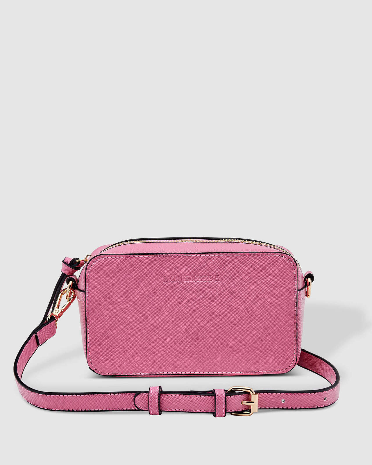 The Rubix Crossbody Bag in Bubblegum Pink by Louenhide is currently available at Rawspice Boutique.