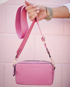 The Rubix Crossbody Bag in Bubblegum Pink by Louenhide is currently available at Rawspice Boutique.