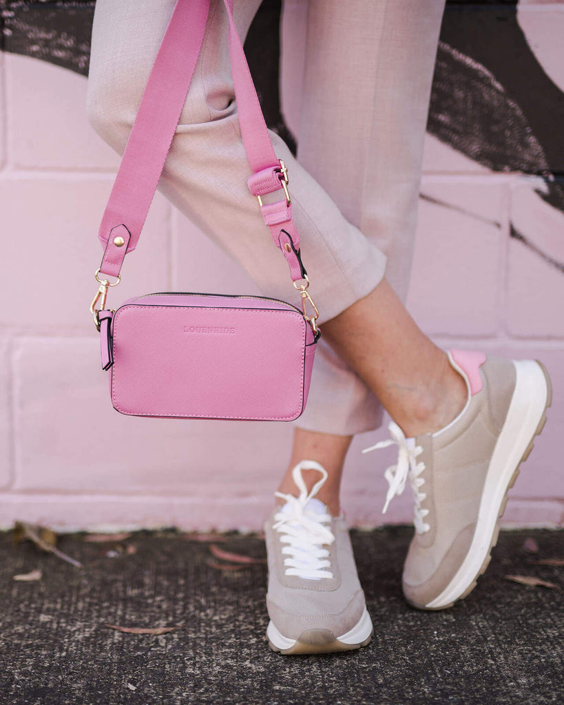 The Rubix Crossbody Bag in Bubblegum Pink by Louenhide is currently available at Rawspice Boutique.