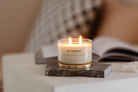 Meeraboo Gold Lid Soy Candle in a clear glass vessel with a brushed gold lid and double wicks, hand-poured with soy wax for long-lasting fragrance.
