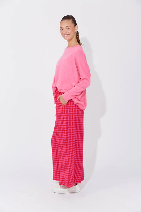 Casablanca Pants in Chilli/Pink featuring a high-rise fit, elastic waist with drawstring, inseam pockets, wide straight leg, and ankle-length cut.