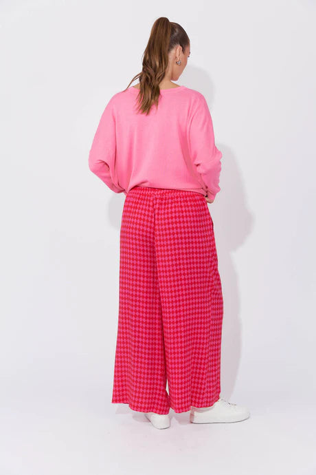 Casablanca Pants in Chilli/Pink featuring a high-rise fit, elastic waist with drawstring, inseam pockets, wide straight leg, and ankle-length cut.