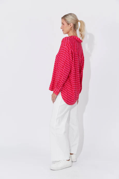 Casablanca Top in Chilli/Pink featuring a collar, button-down front, drop shoulders, long cuffed sleeves with tab detail, and a curved high-low hem.