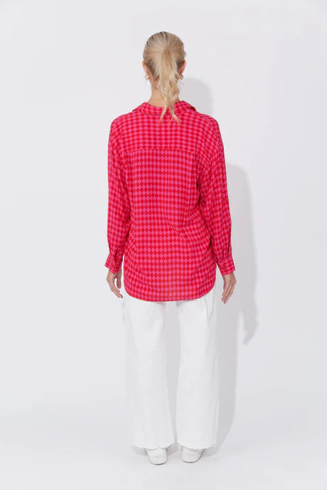 Casablanca Top in Chilli/Pink featuring a collar, button-down front, drop shoulders, long cuffed sleeves with tab detail, and a curved high-low hem.