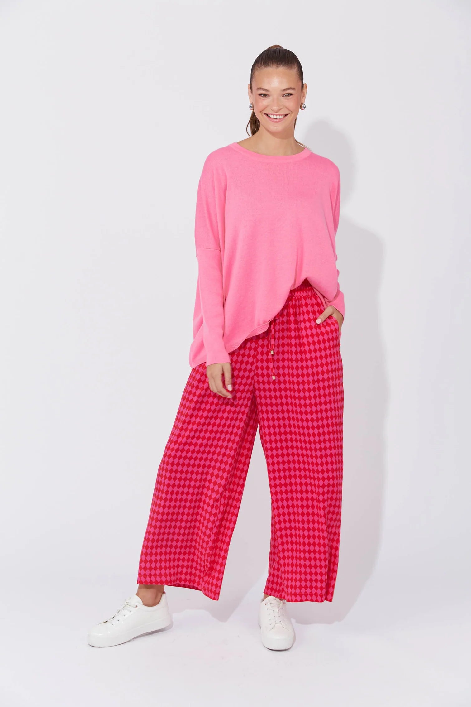 Casablanca Pants in Chilli/Pink featuring a high-rise fit, elastic waist with drawstring, inseam pockets, wide straight leg, and ankle-length cut.