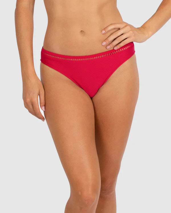 A close up of a woman modelling the Baku Swim Wear - Rococco Ladder Lace Regular Bikini Bottom in Cherry
