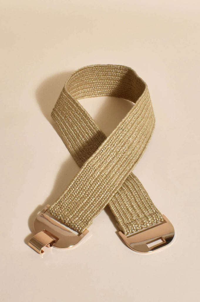 The Metal Clasp Front Stretch Belt in Natural is currently available from Rawspice Boutique.