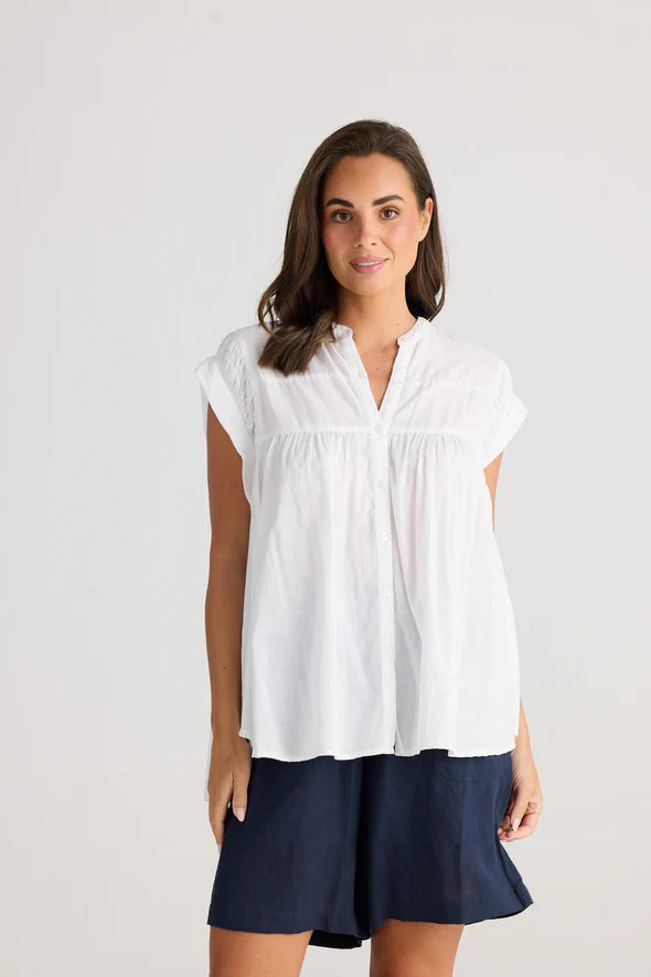 A woman modelling the Clementine Short Sleeve White Top by Holiday