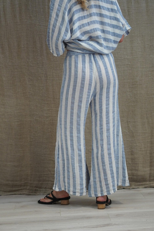 The Cornflower Blue & White Stripes Alessa Wide Leg Pants by Rustic Linen are available at Rawspice Boutique.