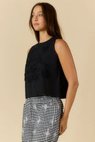 Cornelli Top featuring delicate embroidery and a sleeveless design, available in blue stripe, pink stripe and black.
