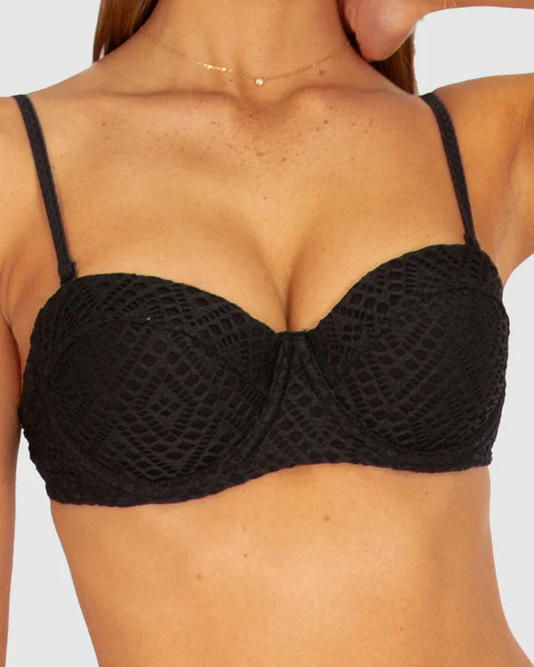 A black balconette bikini top with moulded underwire cups, boning support, and removable adjustable straps, crafted from textured crochet fabric.