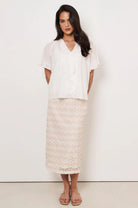 Denise Daisy Chain Skirt in Natural with daisy lace, centre-back split, elasticised waistband, and concealed side zip.