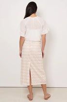 Denise Daisy Chain Skirt in Natural with daisy lace, centre-back split, elasticised waistband, and concealed side zip.