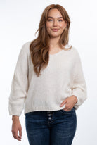 Daria Jumper with a flattering V-neck, relaxed batwing sleeves and an oversized fit, styled for effortless everyday comfort.
