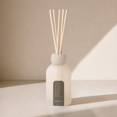 al.ive Willow Gum & Lemon Myrtle reed diffuser in a frosted glass vessel with natural reeds.