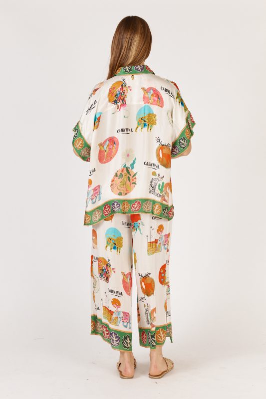 Rubyaya Down Under Shirt in white with matching print, featuring a relaxed oversized fit, button-through front, short sleeves, and lightweight viscose fabric.