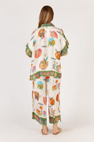 Rubyaya Down Under Shirt in white with matching print, featuring a relaxed oversized fit, button-through front, short sleeves, and lightweight viscose fabric.