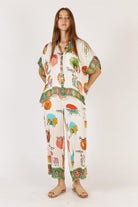 Rubyaya Down Under Shirt in white with matching print, featuring a relaxed oversized fit, button-through front, short sleeves, and lightweight viscose fabric.