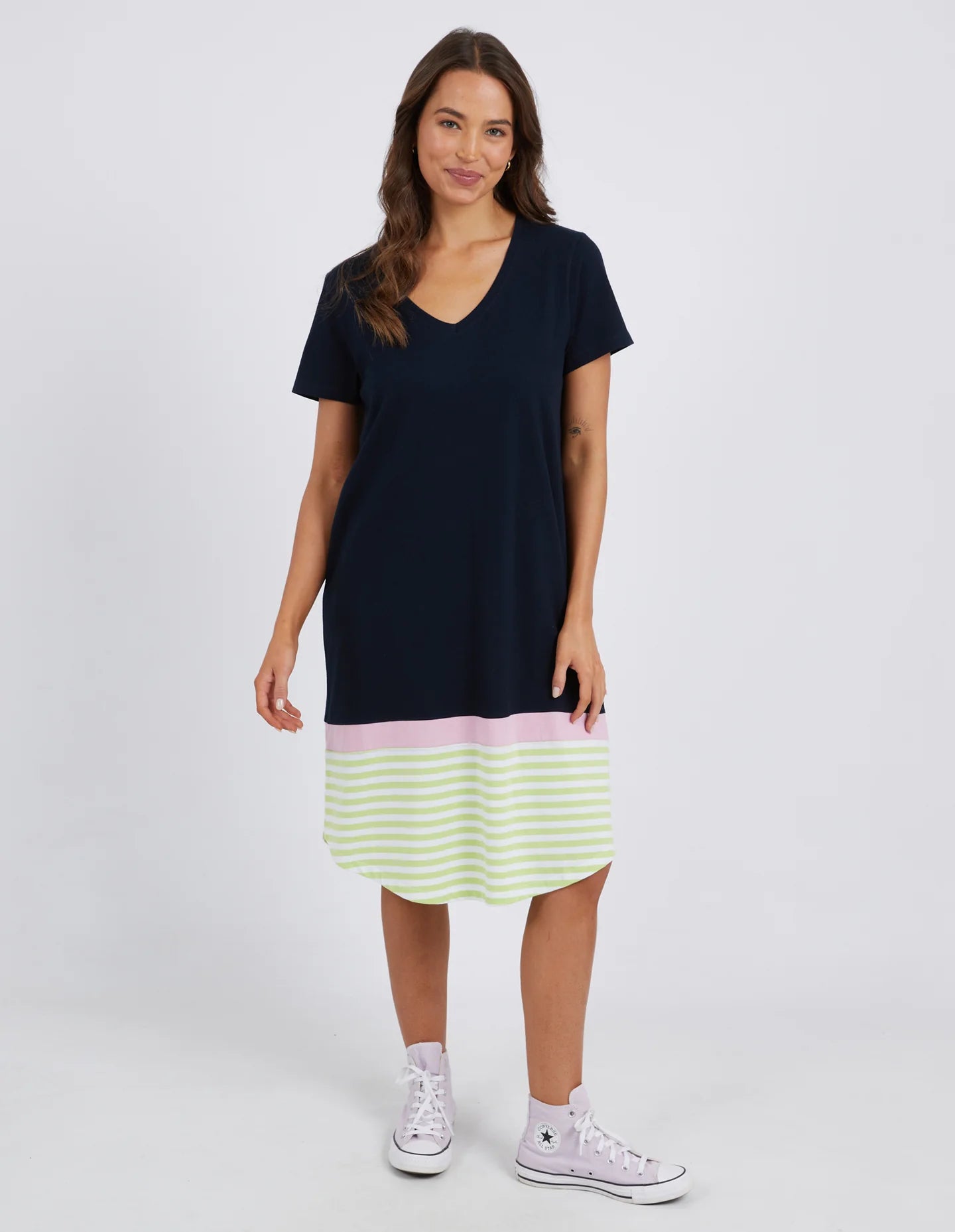 The Navy & Keylime Draw The Line Tee Dress by Elm is currently available at Rawspice Boutique. 