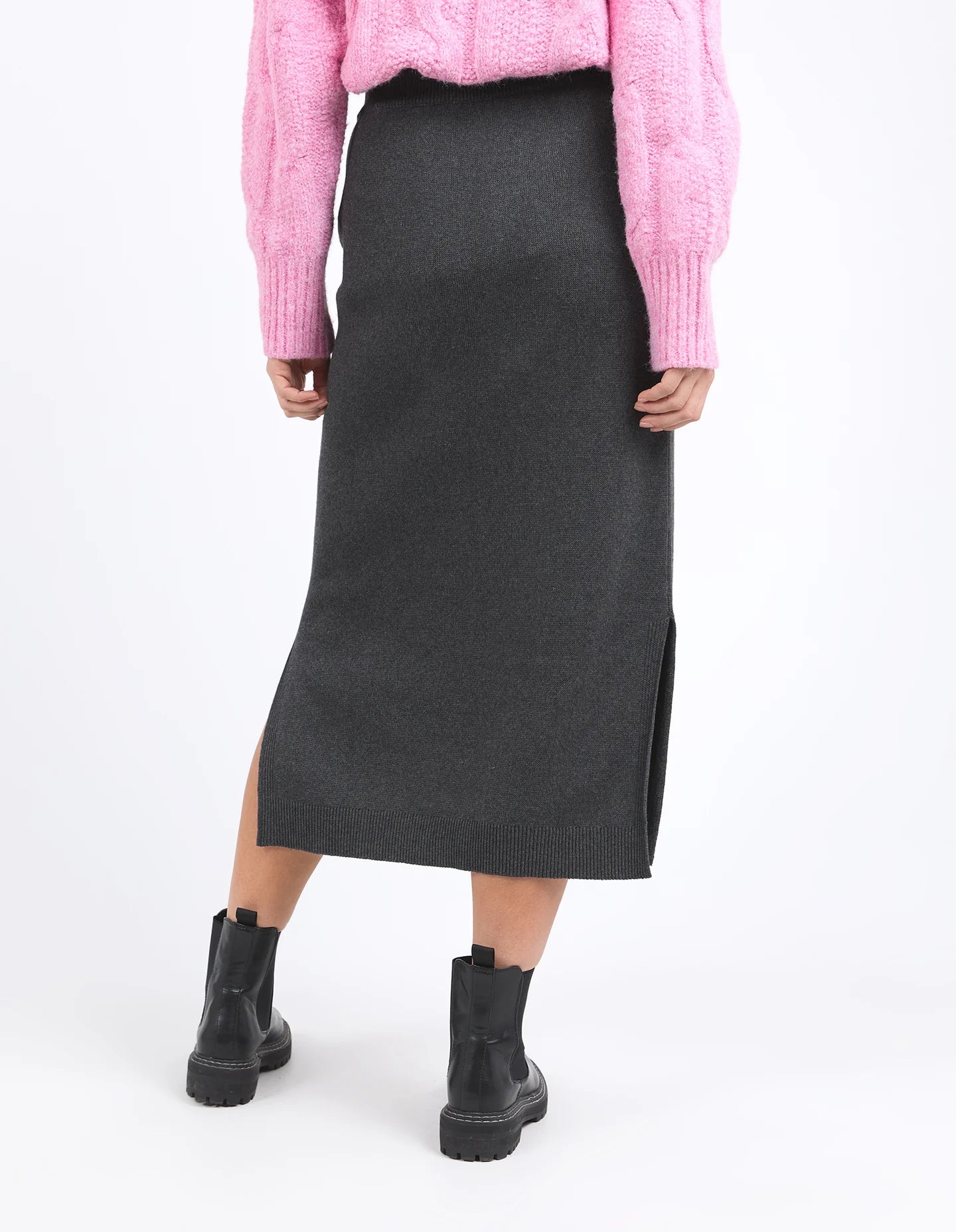 Charcoal marle knit skirt with calf-length cut, side splits, and an elastic waist, offering a flattering and versatile fit for every season.
