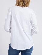 The White Everyday Long Sleeve by Elm is currently available at Rawspice Boutique.