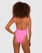 A bold flamingo-pink one-piece swimsuit with a low back, elongated leg line, Rio bottom coverage, and textured Italian fabric for a stylish, flattering fit.