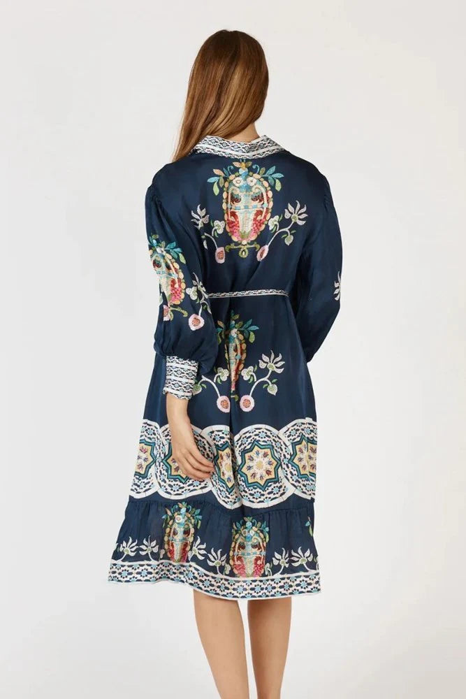 Rubyaya Garcia Dress in navy, a flowing maxi dress with a V-neckline, button-through front, and tie waist in lightweight viscose satin.