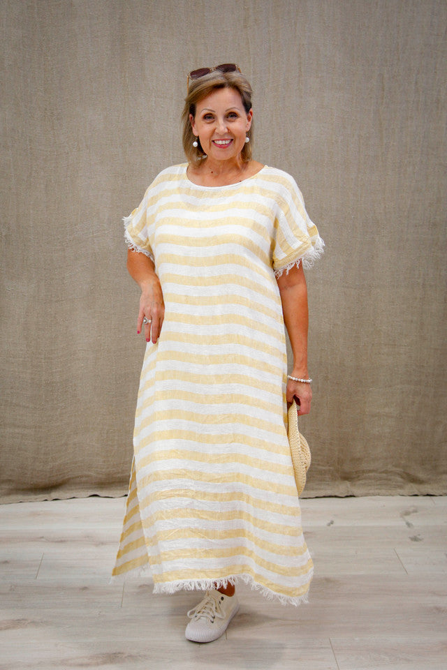 The Lemon Stripe Gemma Fringed Dress by Rustic Linen is available at Rawspice Boutique.