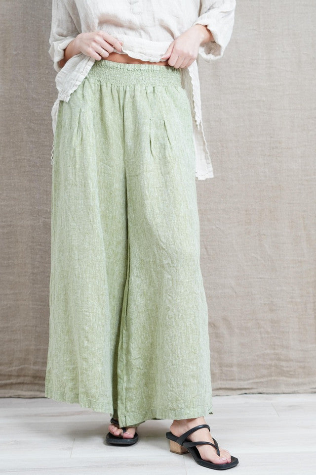 Relaxed-fit linen pants in Chambray Green, made from 100% fine stonewashed linen. Features an elastic waistband, two side pockets, and a soft, breathable fit for comfort and effortless style.